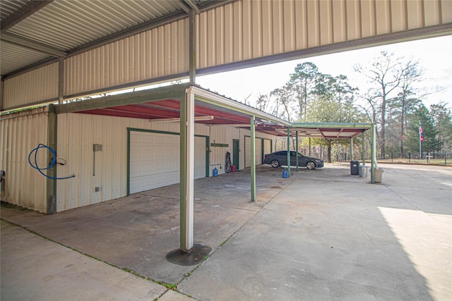 garage featuring a carport