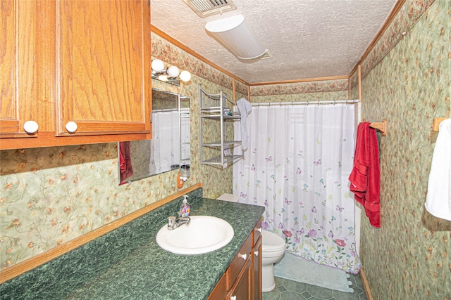 bathroom with vanity, ornamental molding, a textured ceiling, and toilet