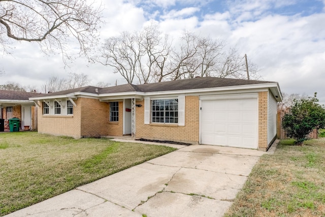 single story home with a garage and a front lawn