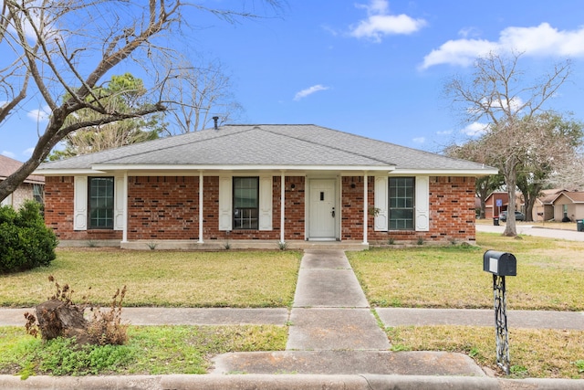 ranch-style house featuring a front lawn