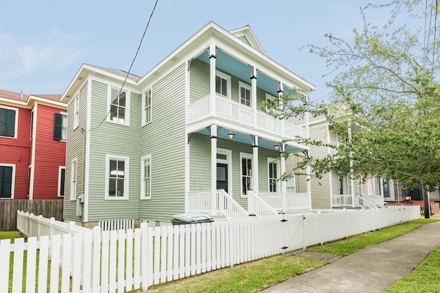 view of front of house featuring a porch and a balcony