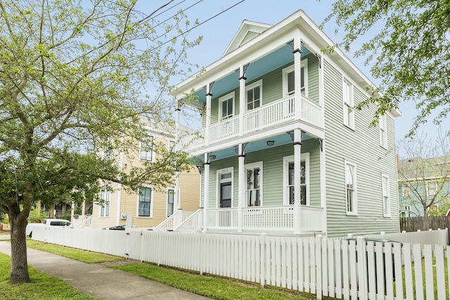 view of front of property with a balcony and a porch