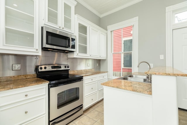 kitchen featuring white cabinetry, sink, crown molding, and stainless steel appliances