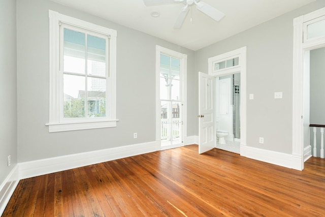 spare room with hardwood / wood-style floors and ceiling fan