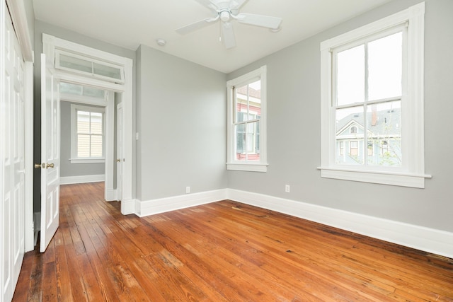 spare room featuring ceiling fan and hardwood / wood-style floors