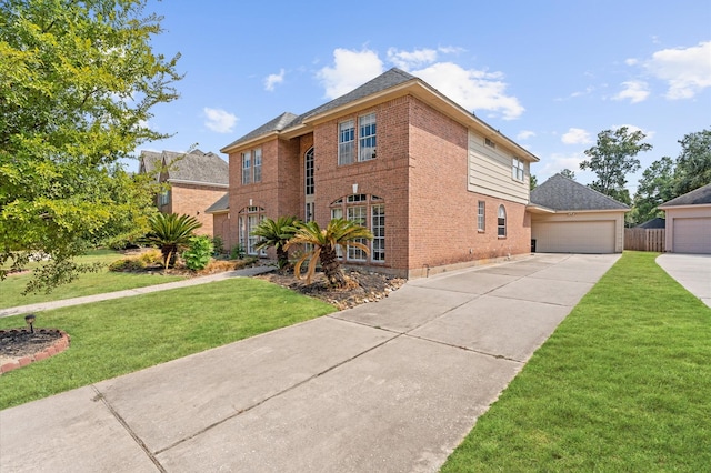 view of front facade featuring a garage and a front lawn