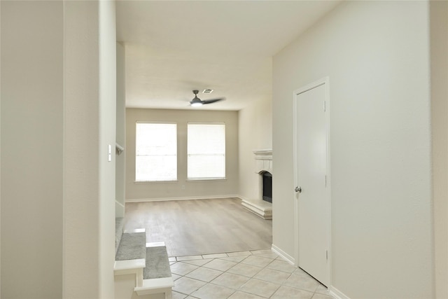 hall with light tile patterned flooring