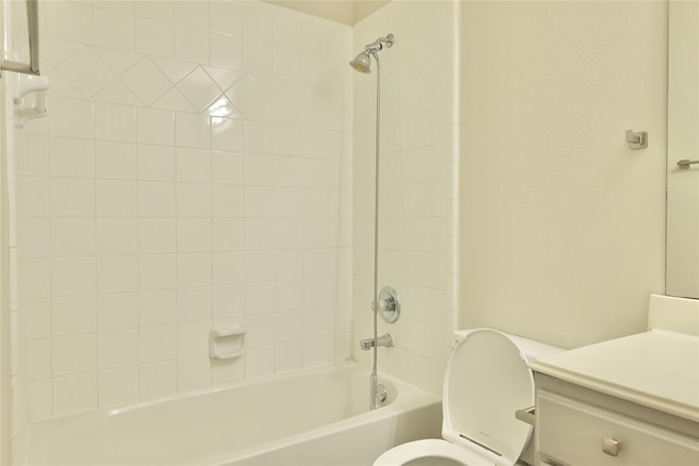 full bathroom featuring vanity, toilet, and tiled shower / bath combo