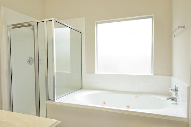 bathroom featuring vanity and separate shower and tub