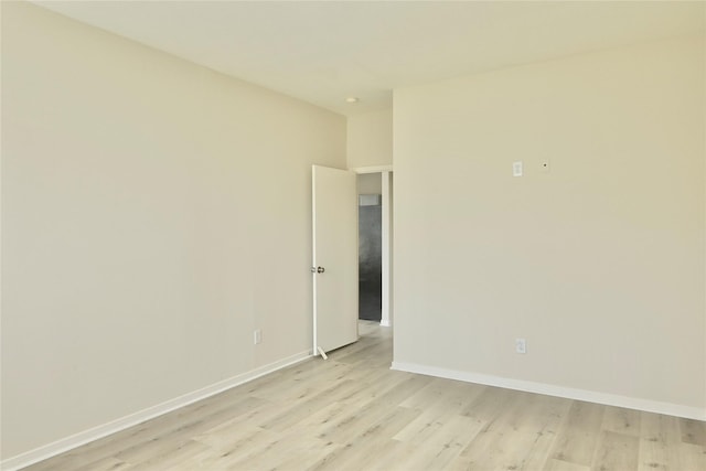 spare room featuring light hardwood / wood-style flooring