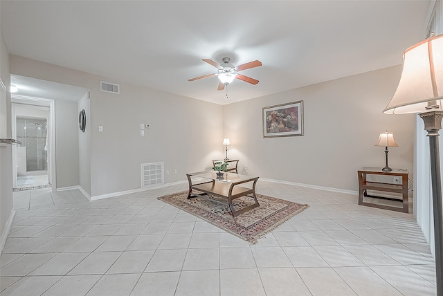 sitting room featuring ceiling fan and light tile patterned flooring