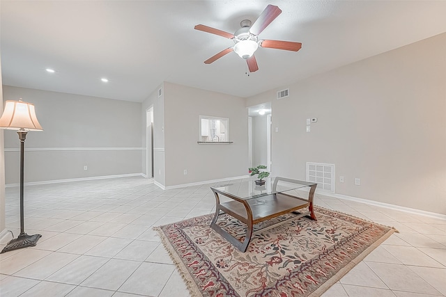 living room featuring light tile patterned floors and ceiling fan