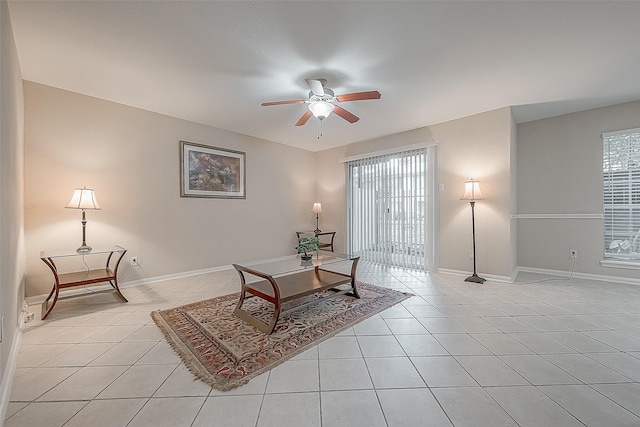 living room featuring ceiling fan, a healthy amount of sunlight, and light tile patterned floors