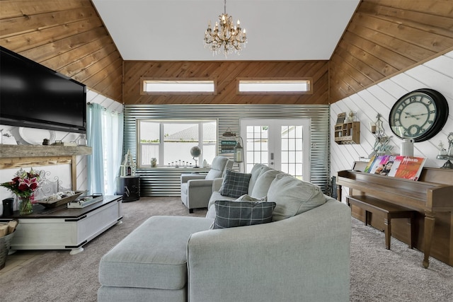 carpeted living room with a wealth of natural light, wooden walls, and high vaulted ceiling