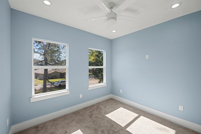 empty room with carpet floors and ceiling fan