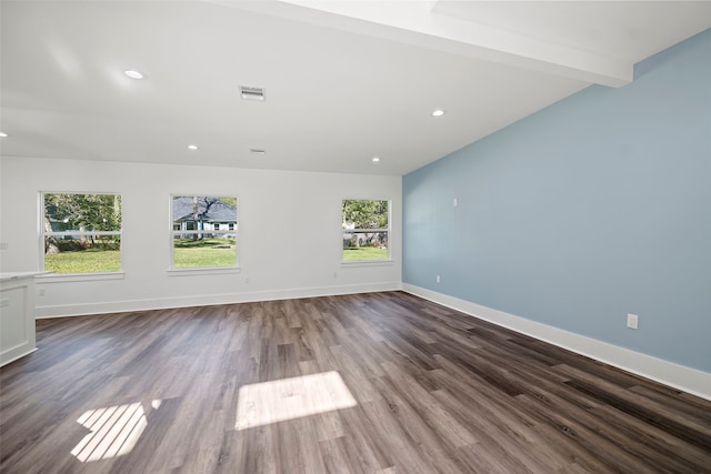 spare room featuring wood-type flooring