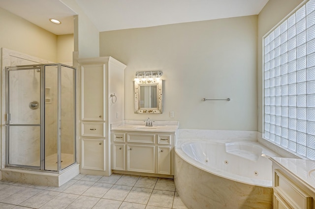 bathroom featuring vanity, tile patterned floors, and separate shower and tub