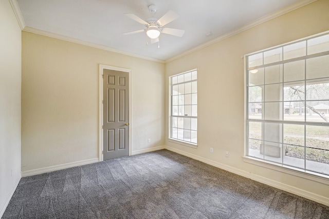 carpeted empty room featuring ornamental molding and ceiling fan