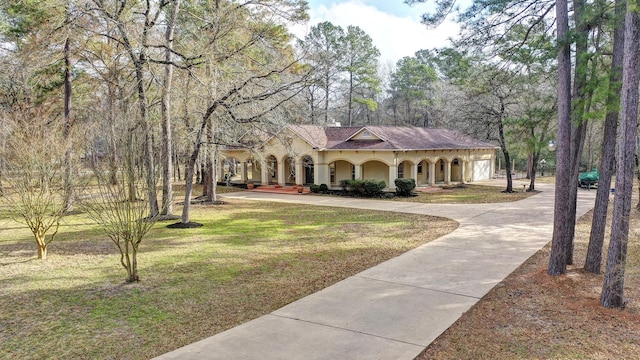 view of front of house featuring a front yard and covered porch