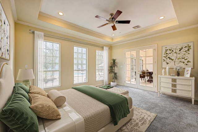 carpeted bedroom with crown molding, ceiling fan, access to exterior, french doors, and a raised ceiling