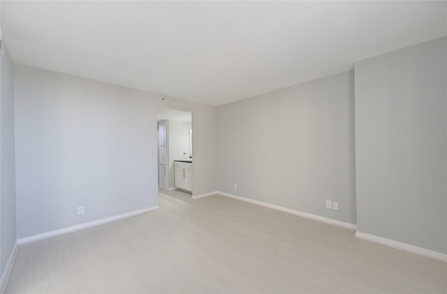 unfurnished room with light hardwood / wood-style floors