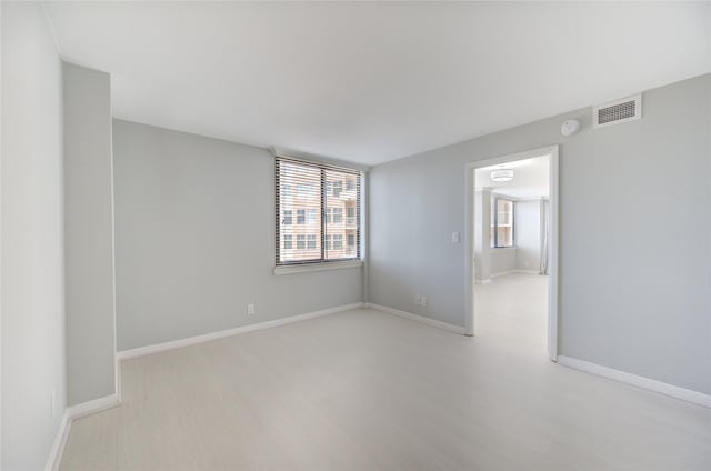 unfurnished room featuring light hardwood / wood-style floors