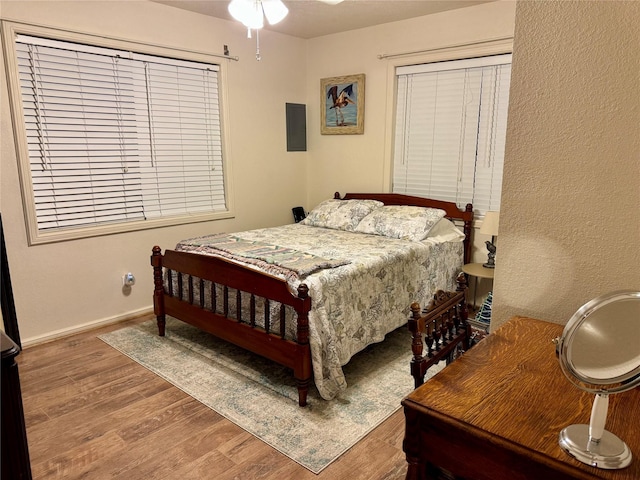 bedroom with hardwood / wood-style flooring