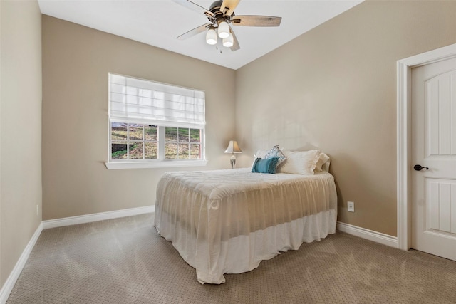 bedroom featuring light colored carpet and ceiling fan