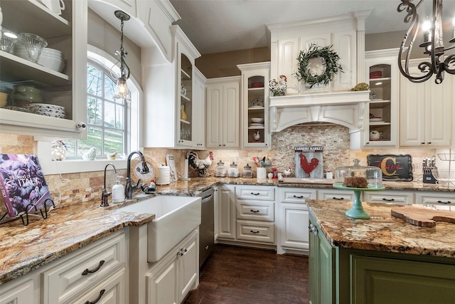 kitchen featuring sink, hanging light fixtures, light stone countertops, white cabinets, and stainless steel dishwasher