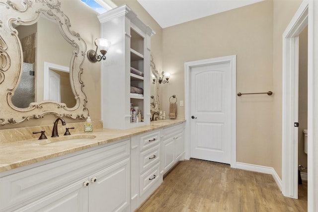 bathroom featuring vanity and hardwood / wood-style floors