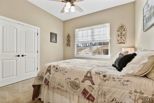 bedroom with a closet, ceiling fan, and carpet flooring