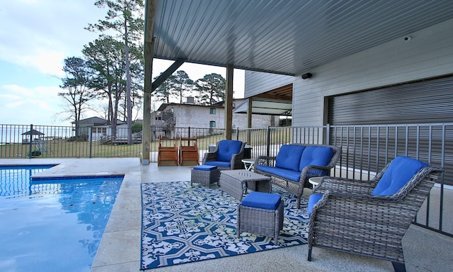 view of pool with an outdoor living space and a patio