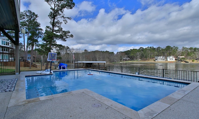 view of pool featuring a water view