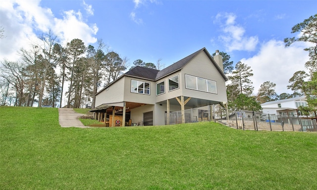 rear view of house with a lawn