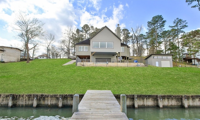 dock area with a yard and a water view