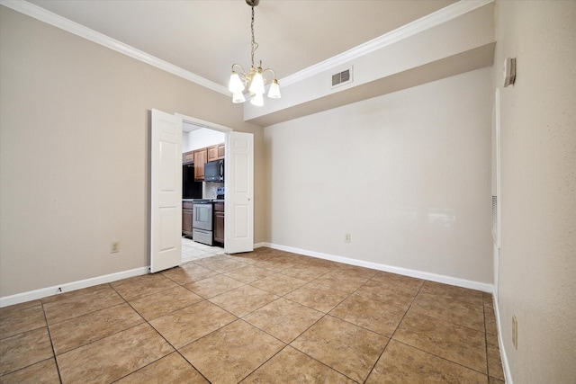 spare room featuring crown molding, tile patterned floors, and an inviting chandelier