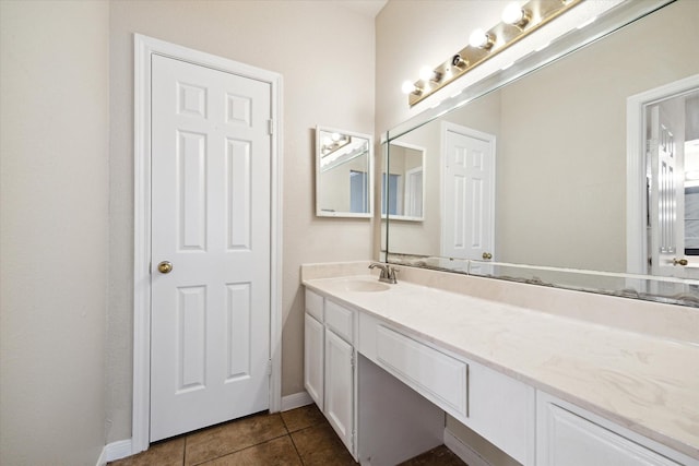 bathroom with tile patterned floors and vanity