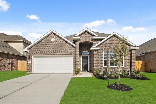 view of front of home featuring a garage and a front lawn