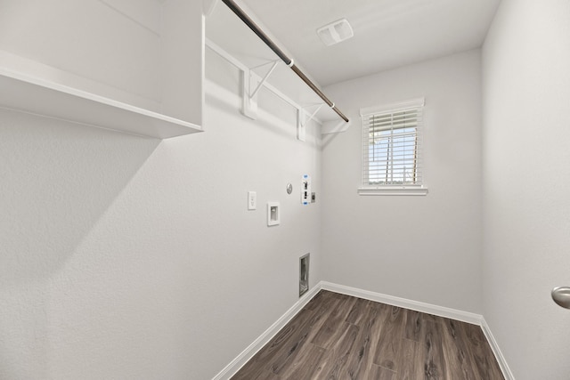 laundry room featuring gas dryer hookup, laundry area, dark wood-type flooring, washer hookup, and baseboards