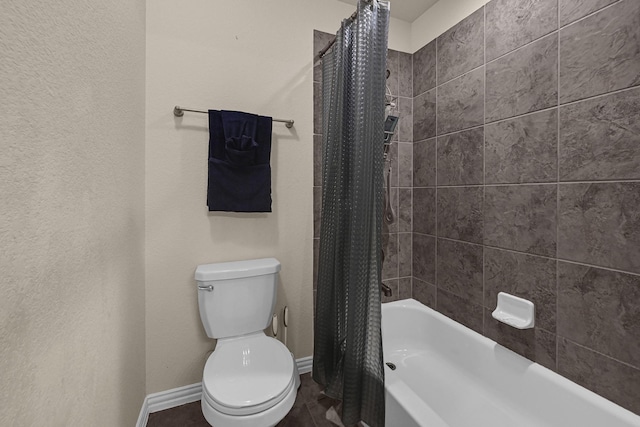 bathroom featuring toilet, tile patterned floors, and shower / bathtub combination with curtain