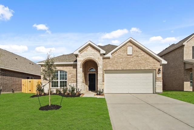 view of front facade with a garage and a front lawn