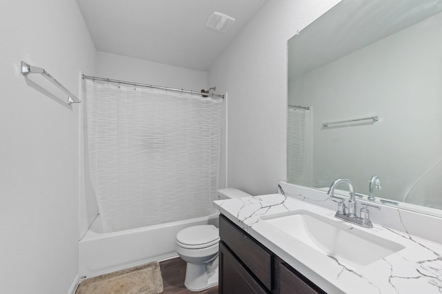 full bathroom with vanity, toilet, and shower / bath combo with shower curtain