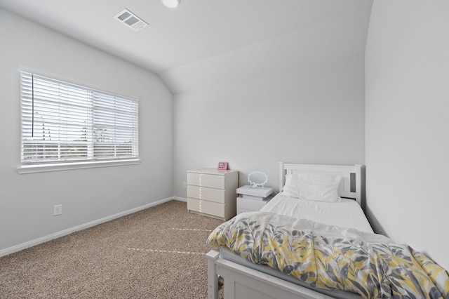 bedroom featuring carpet floors and vaulted ceiling