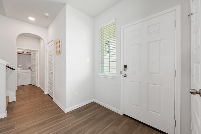 entrance foyer featuring hardwood / wood-style flooring and washer / clothes dryer