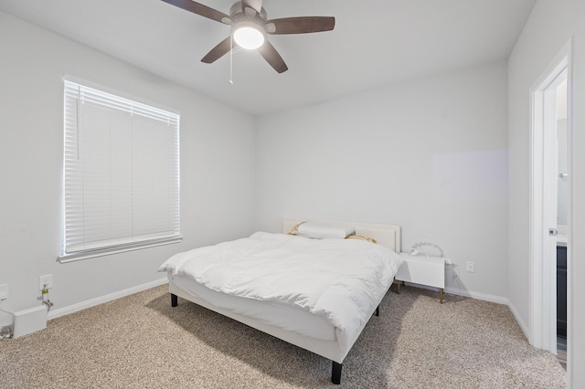 bedroom with ceiling fan and carpet flooring