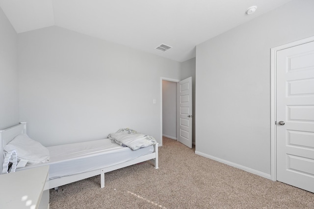 bedroom featuring carpet flooring and vaulted ceiling