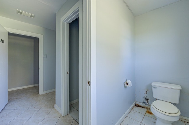 bathroom with tile patterned floors and toilet