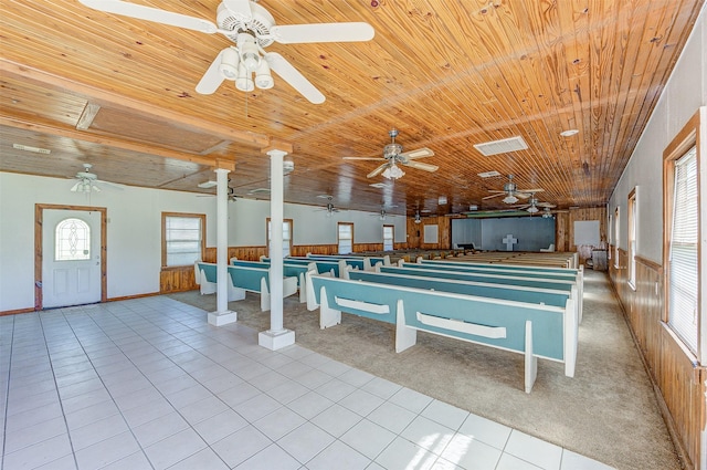 misc room featuring light tile patterned floors and wooden ceiling