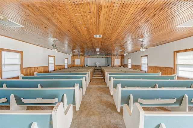 miscellaneous room featuring light carpet, wood ceiling, and ceiling fan