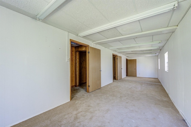 unfurnished room with light carpet